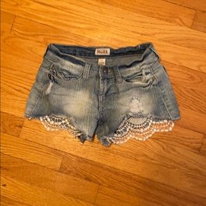 Distressed denim shorts